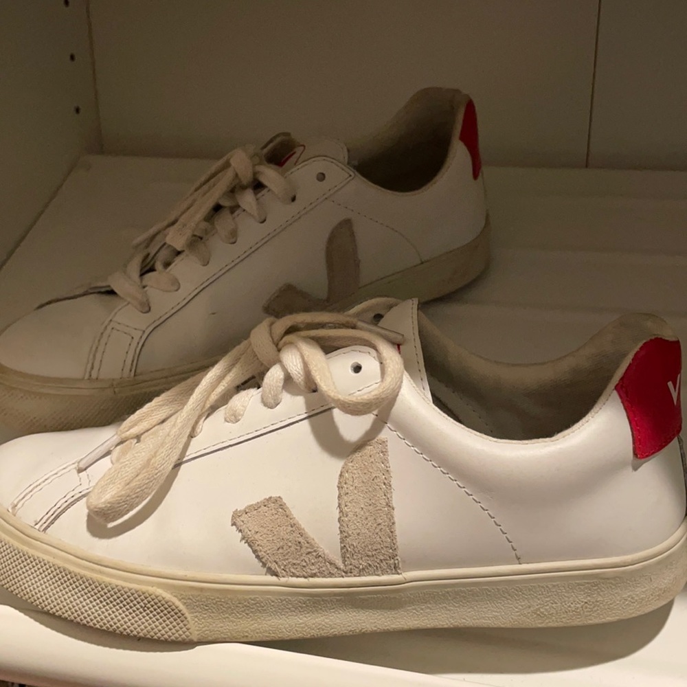 White sneaker with red accents